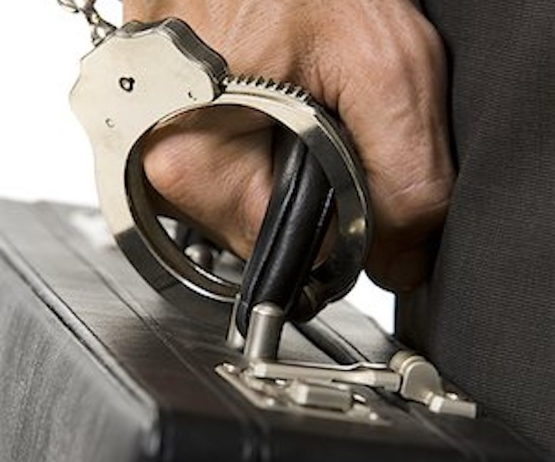 640-01353578
Model Release: Yes
Property Release: No
Businessman handcuffed to a briefcase